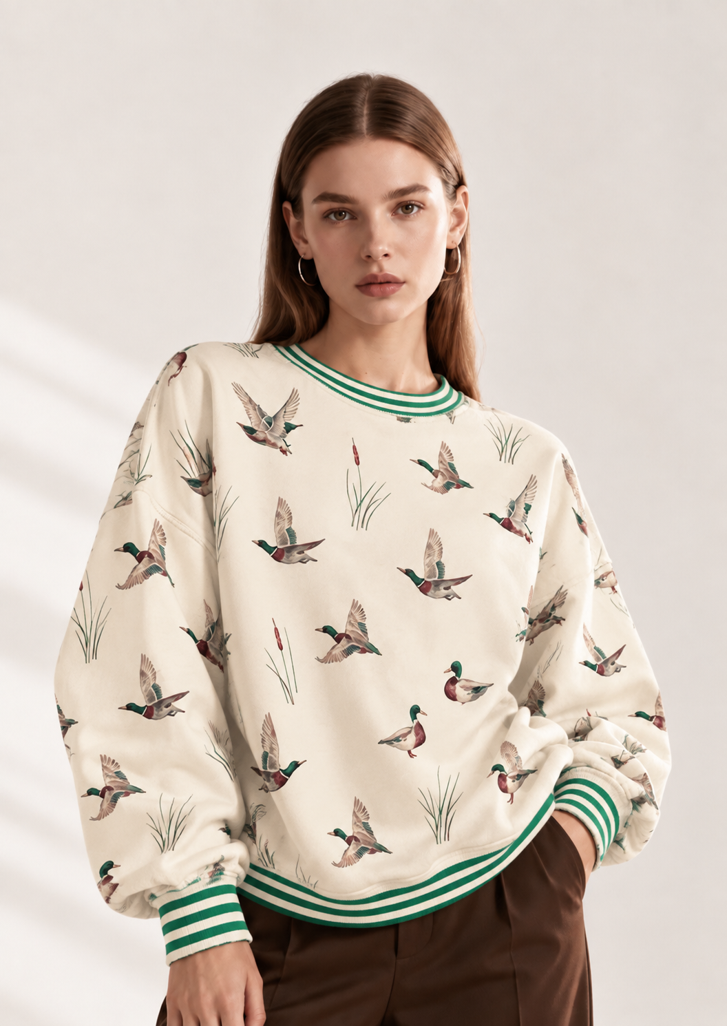 Whimsical Duck Print Sweatshirt with Striped Trim