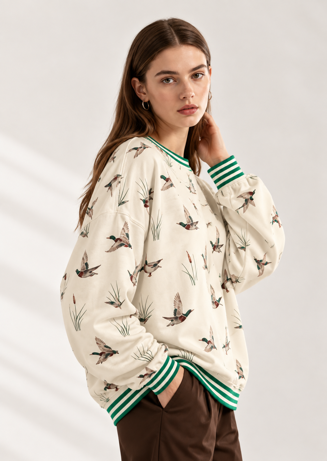Whimsical Duck Print Sweatshirt with Striped Trim
