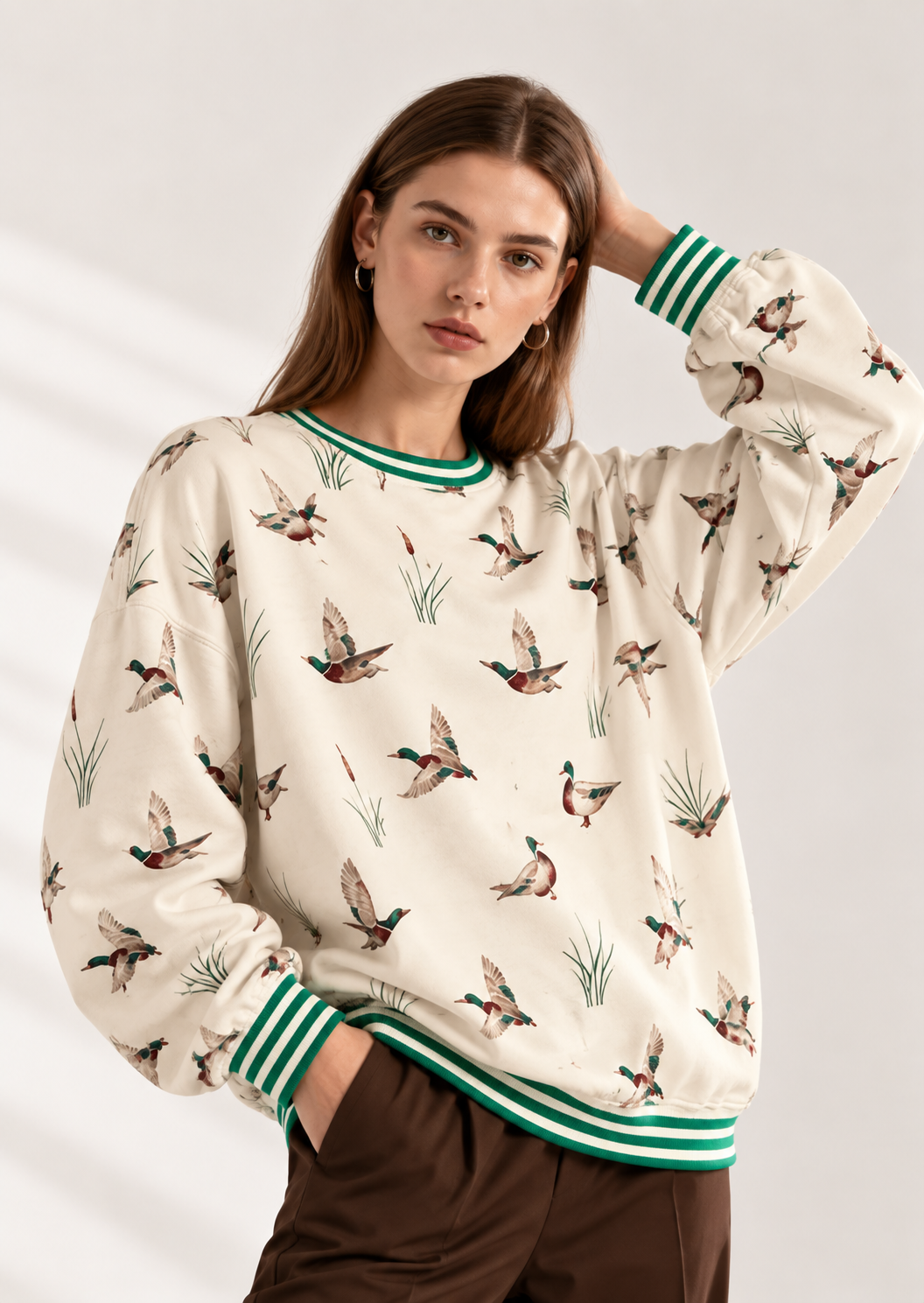 Whimsical Duck Print Sweatshirt with Striped Trim